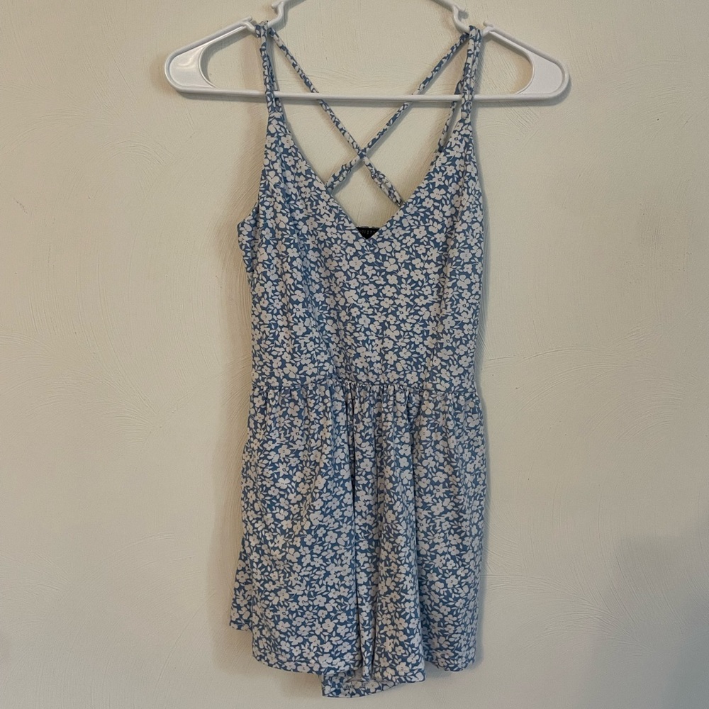 I am selling this Urban Outfitters Blue and White flowered romper.